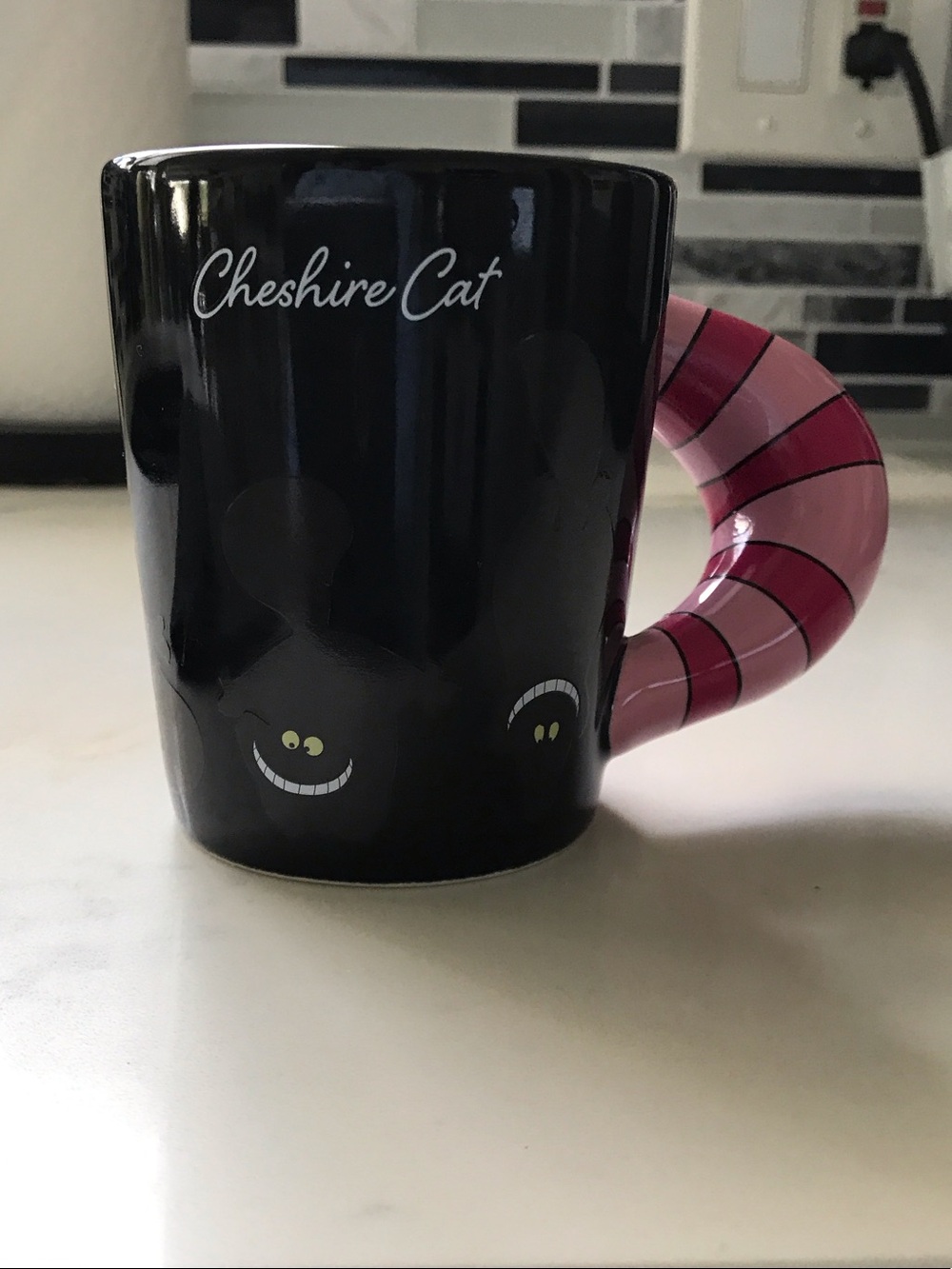 Disney Cheshire Cat Black Mug with Pink Striped Tail Handle Accent
